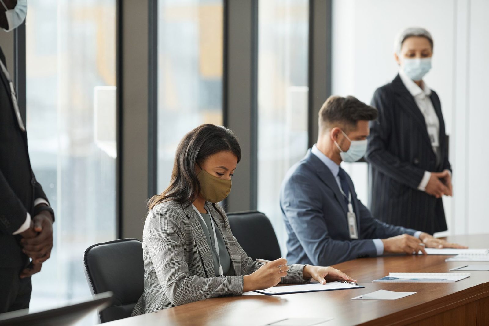 Staff reviewing documents at a conference table