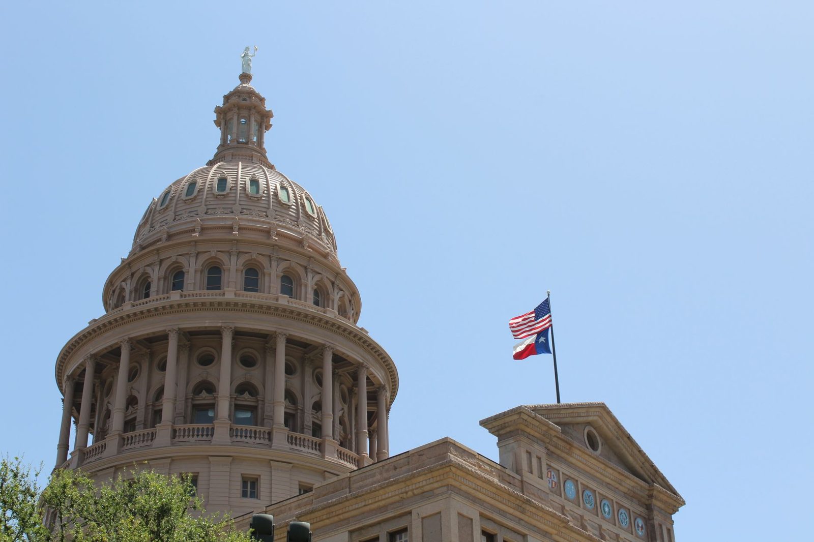 The Texas State Capitol dome with the state flag
