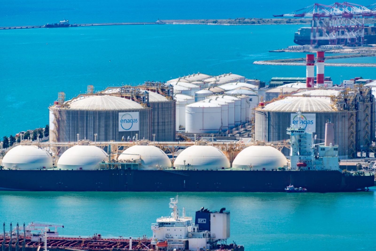 Round storage tanks at a coastal energy terminal