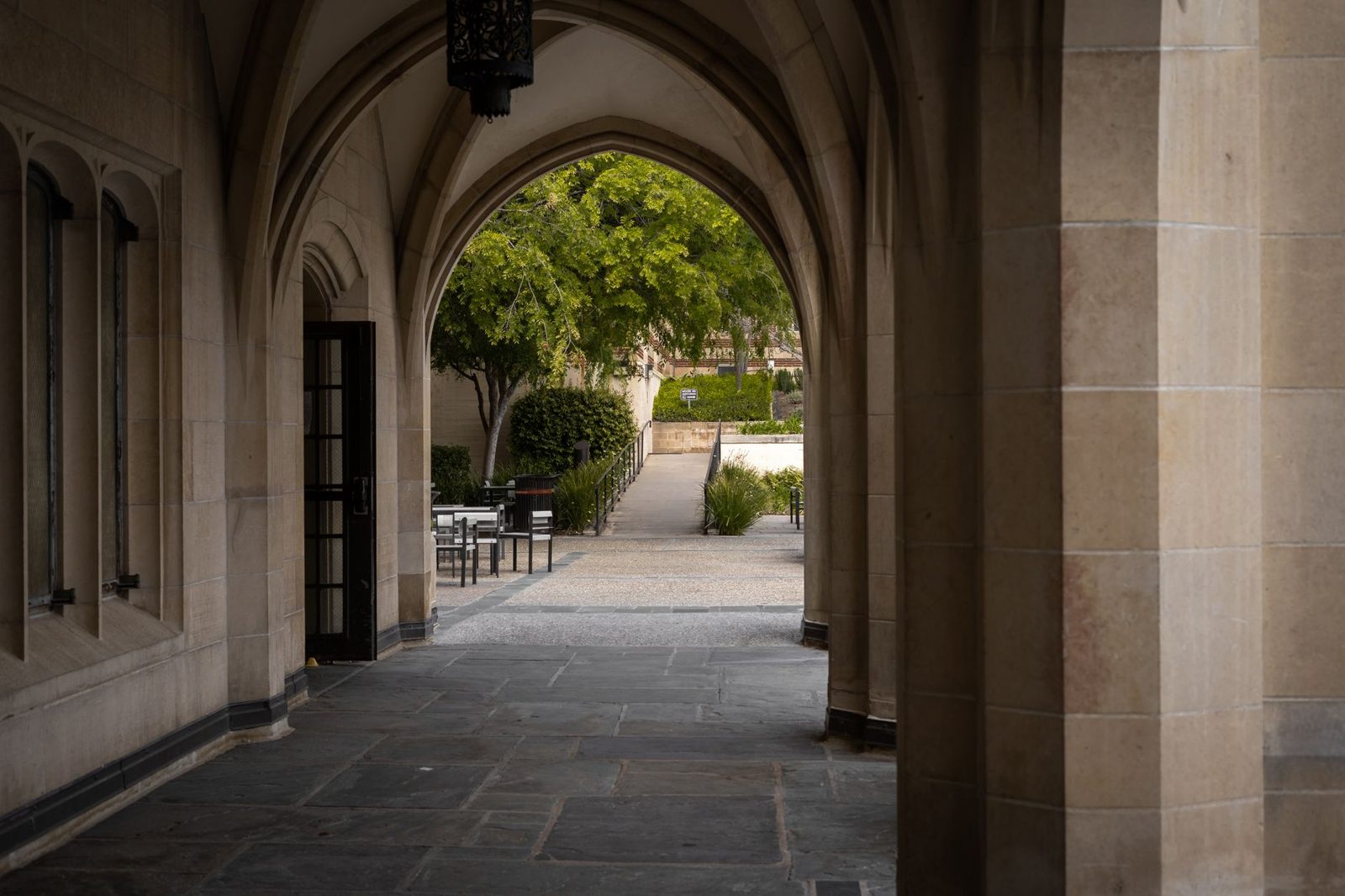 An arched walkway on a college campus