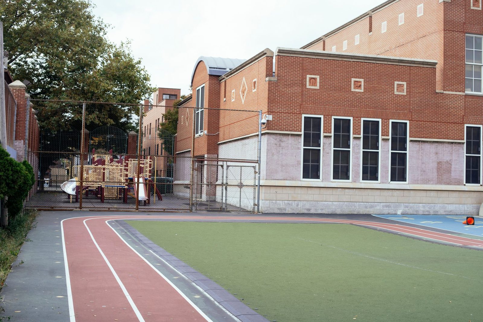 A school track and brick building