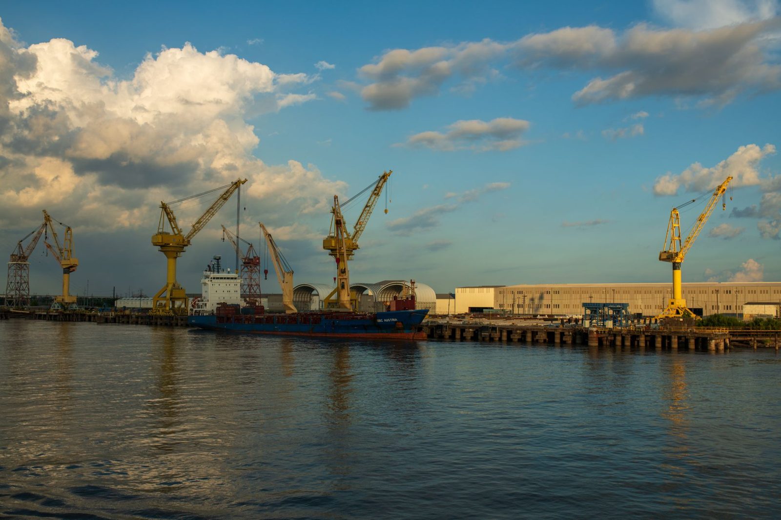 Shipyard cranes along the waterfront
