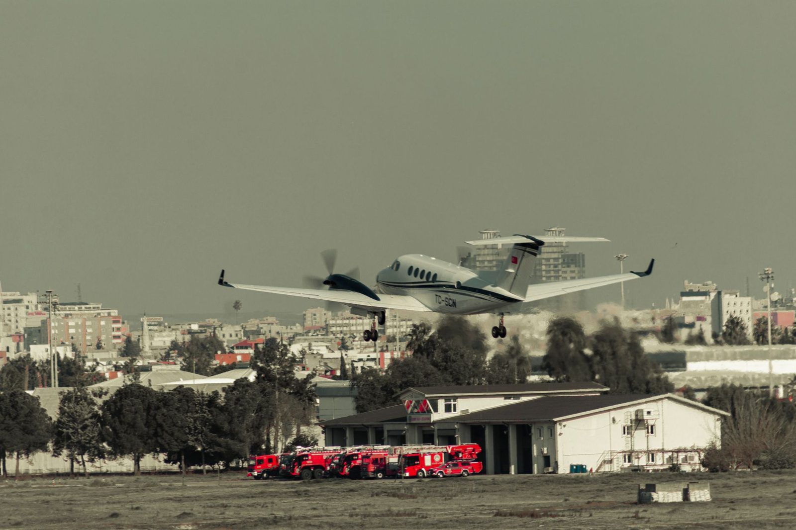 An aerial view of an airfield with parked aircraft