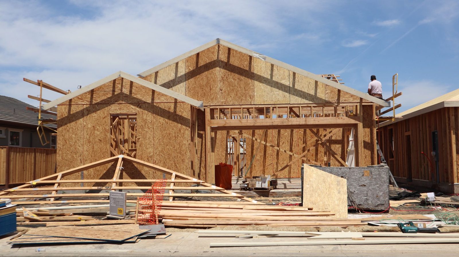 A new house being framed on a cleared lot
