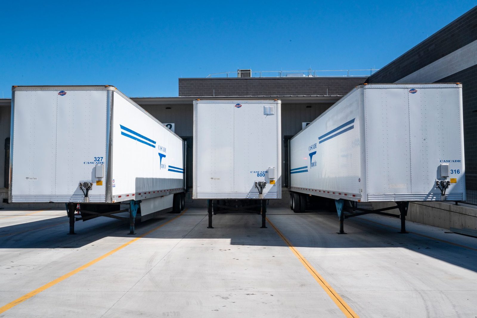 Semi trailers backed into loading dock doors