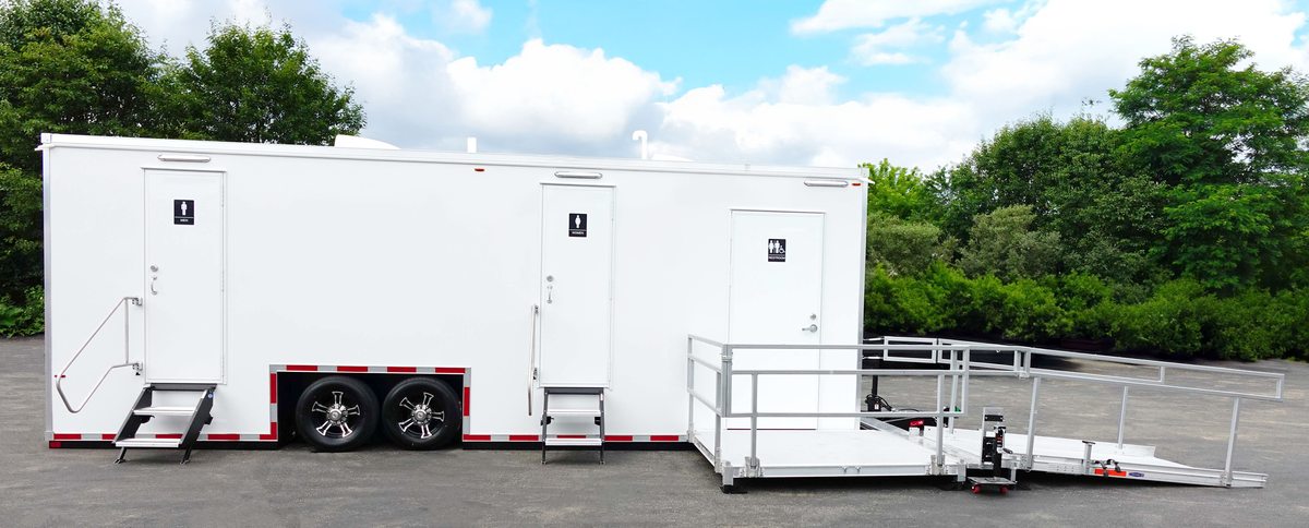 Large accessible bathroom trailer rental combining a ramped ADA suite with six private stations