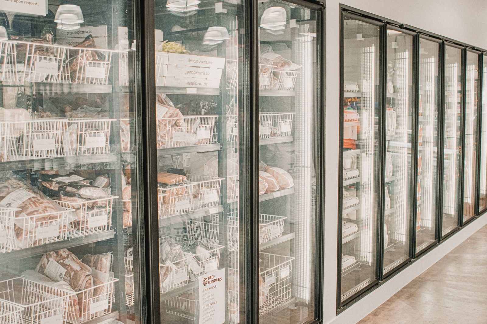 Glass door freezer cases full of frozen food