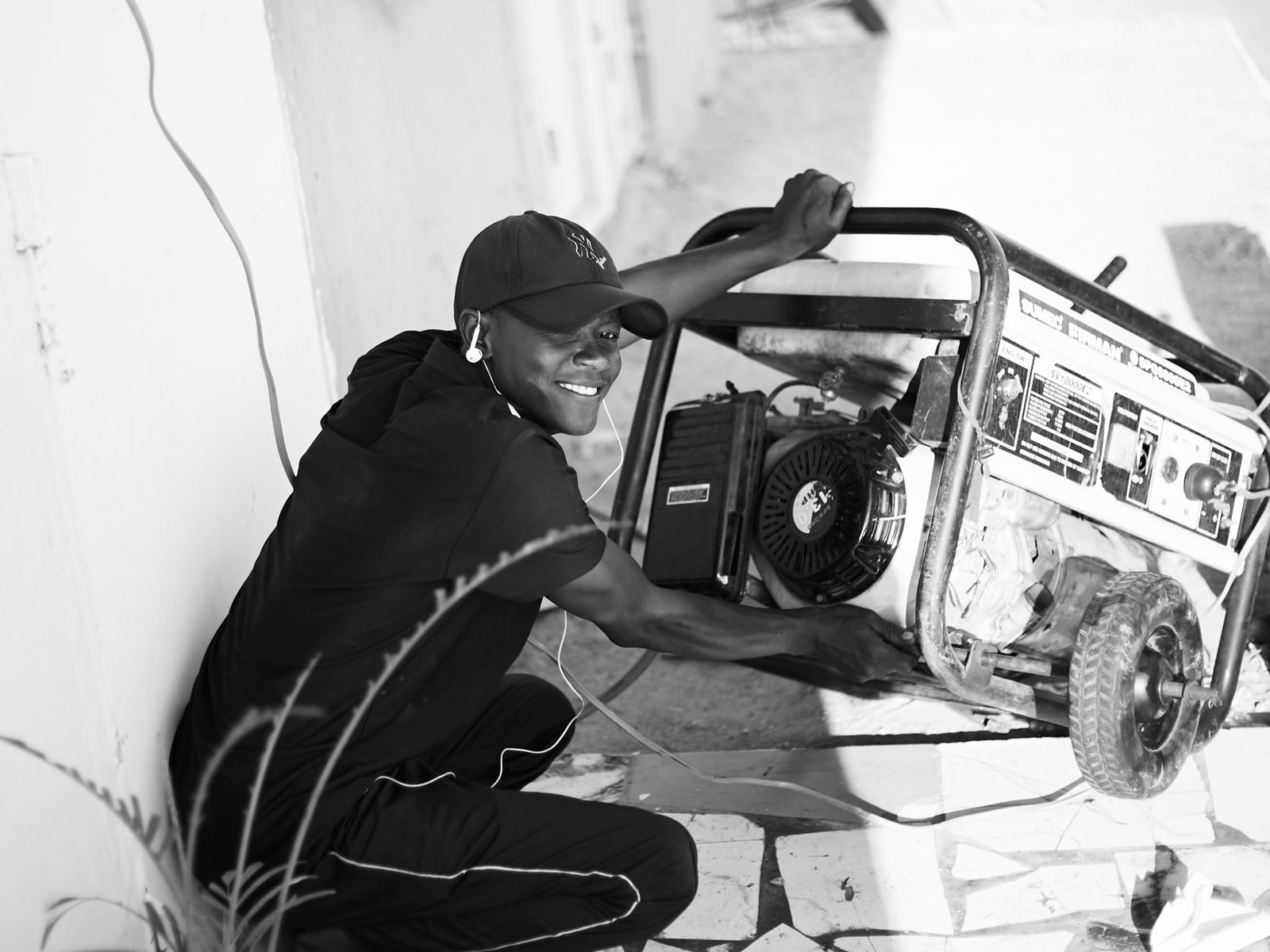 A worker setting up a portable generator