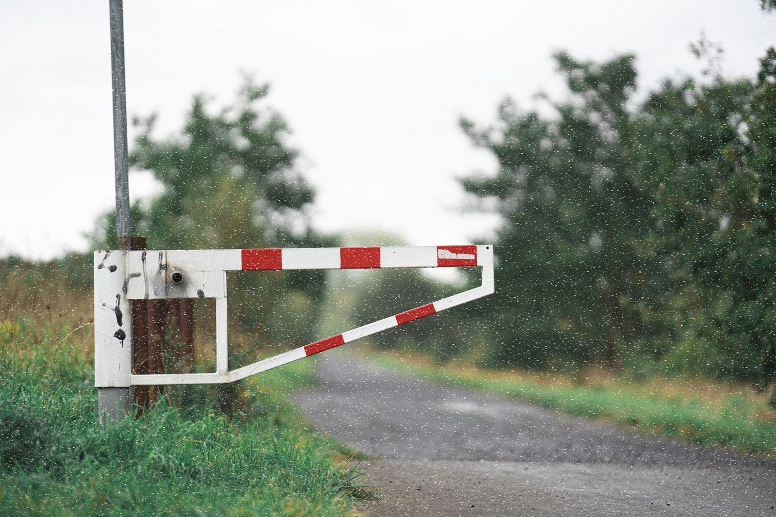A barrier gate across an access road