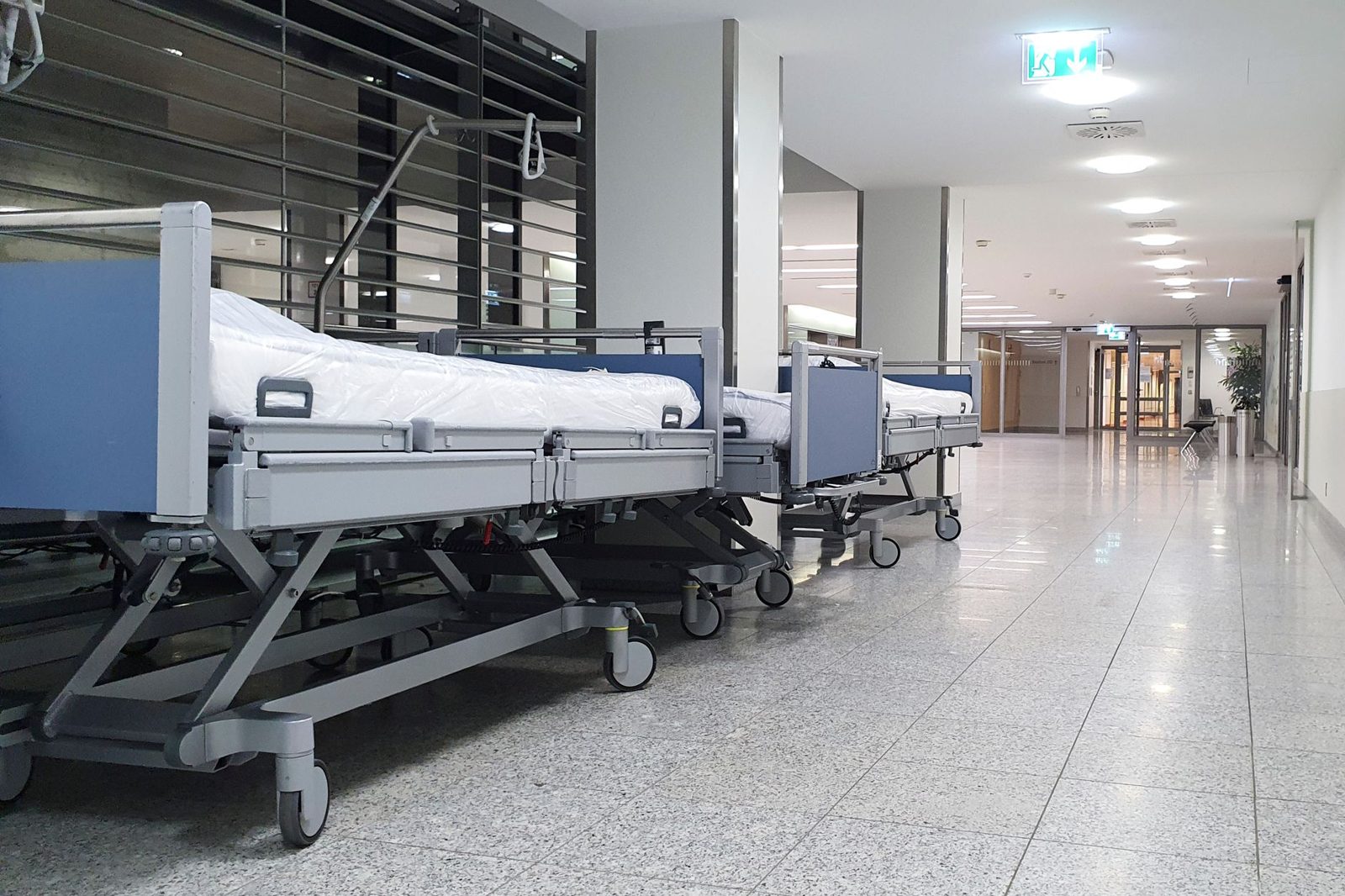 Rows of beds lined up along a hallway