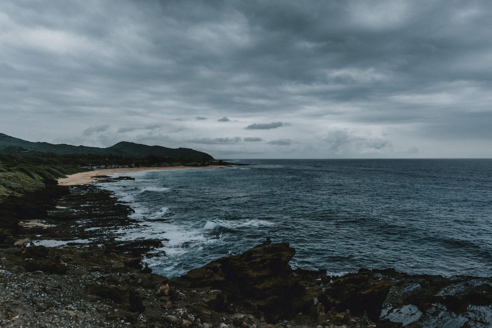Dark storm clouds over the rocky windward coast of Oahu