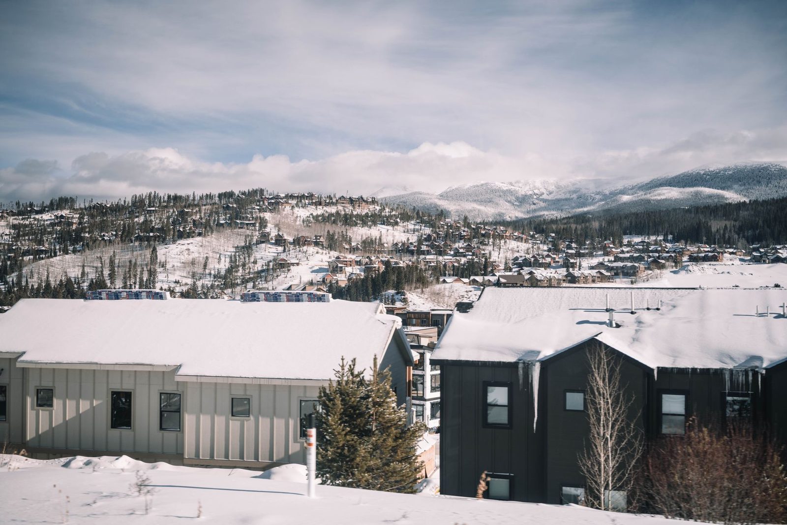New townhomes on a snowy hillside in a Colorado mountain town