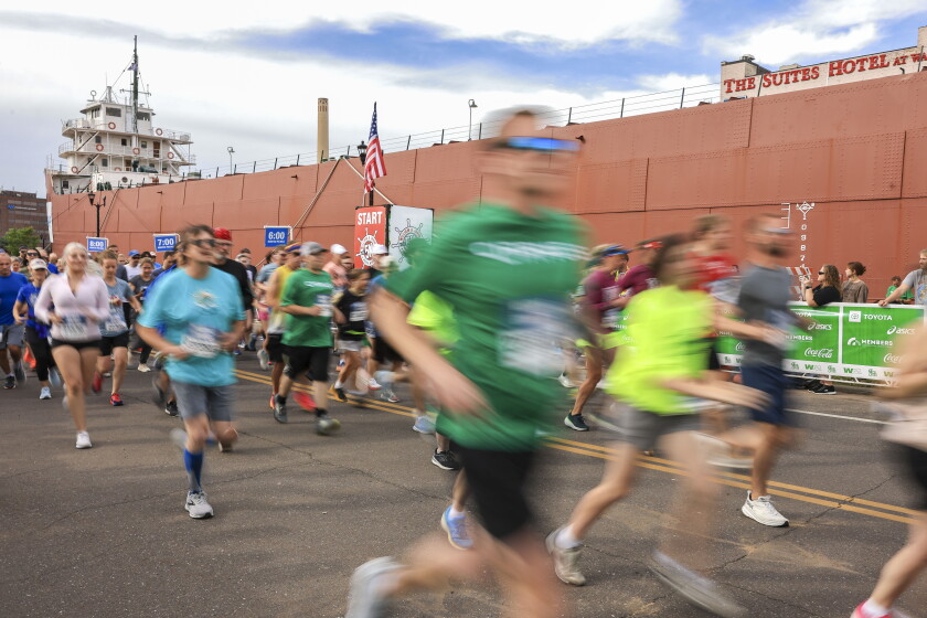 Runners at a Sacramento road race on a warm morning