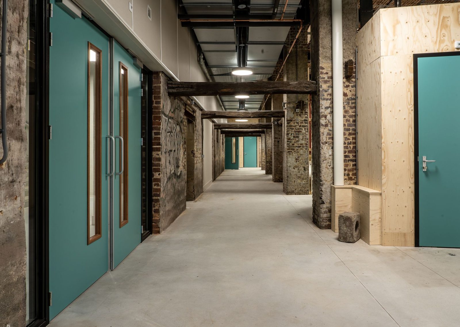 A school hallway stripped back during a renovation