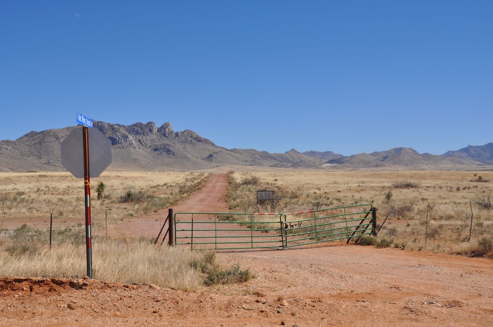 A ranch fence and bare mountains in far West Texas