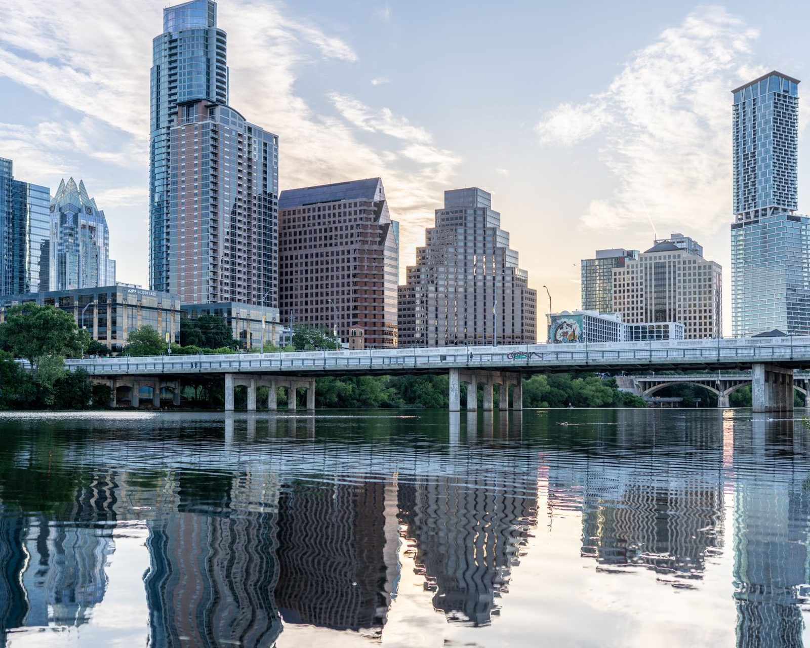 The Austin skyline beside the Colorado River on a clear summer day