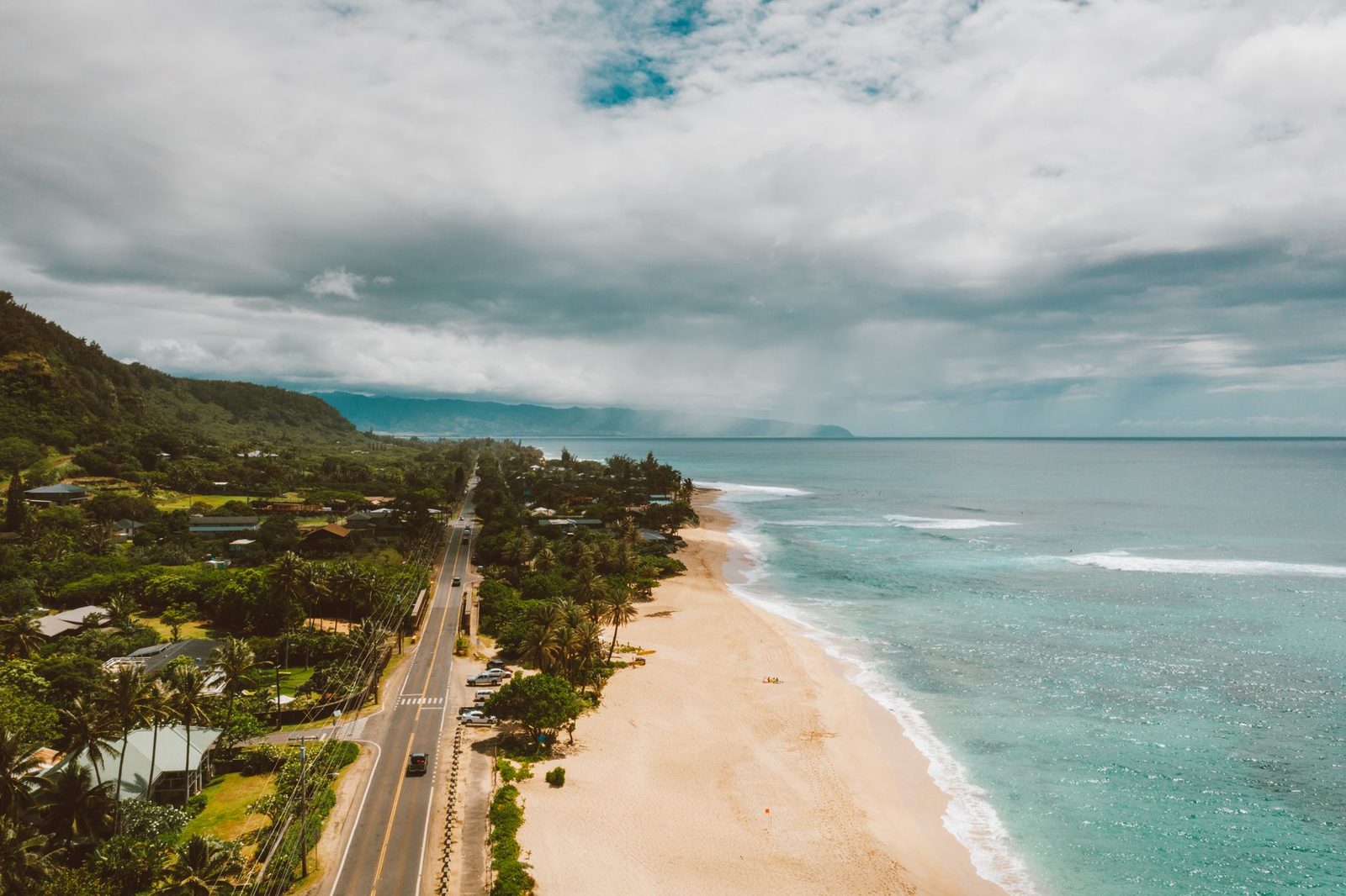 The North Shore highway running beside the beach on Oahu