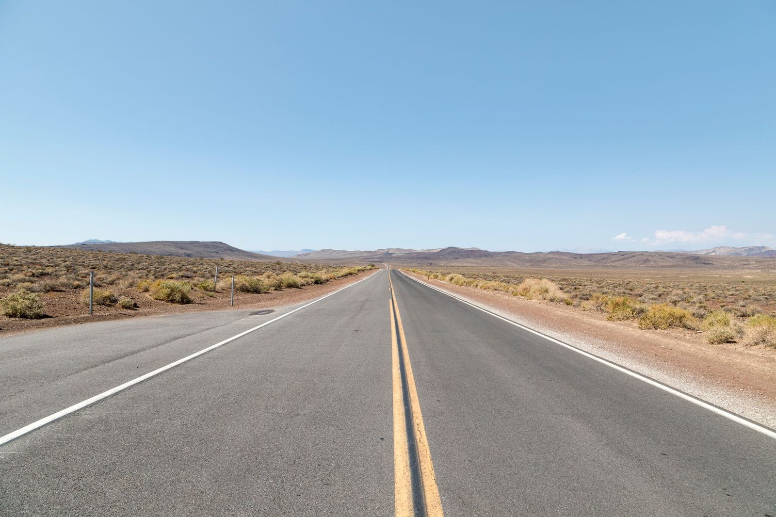 A wide desert basin and two-lane highway near Tonopah, Nevada