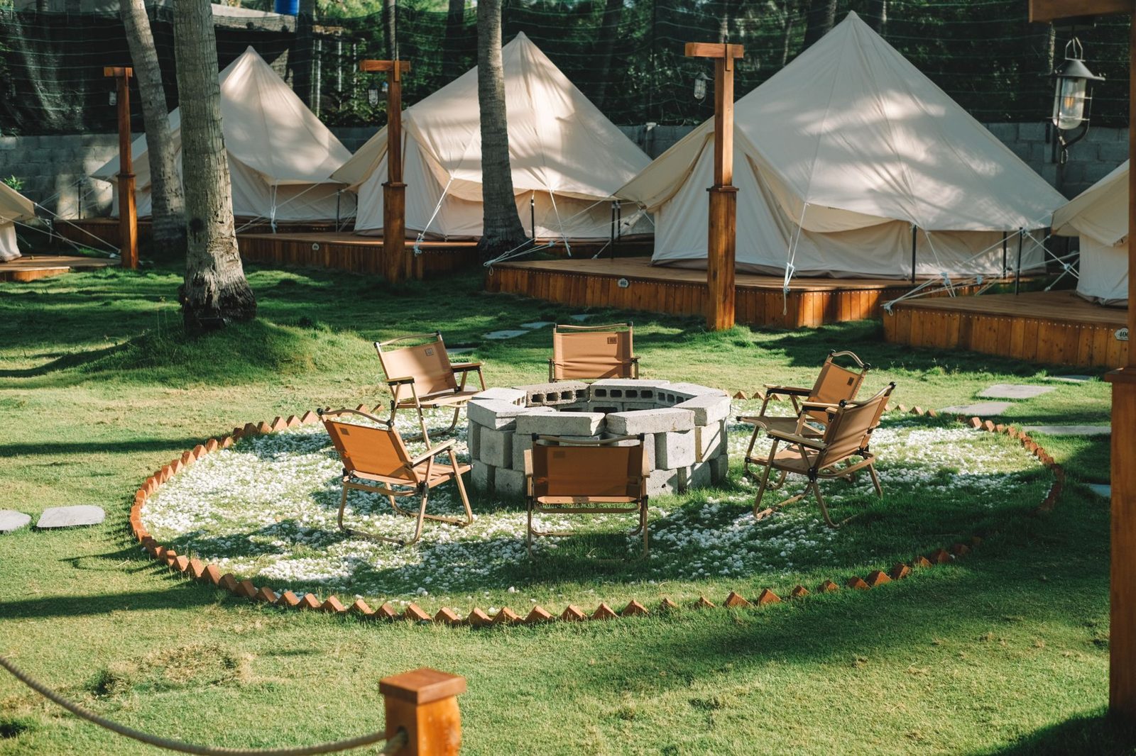 Canvas tents set up in a row at a camp